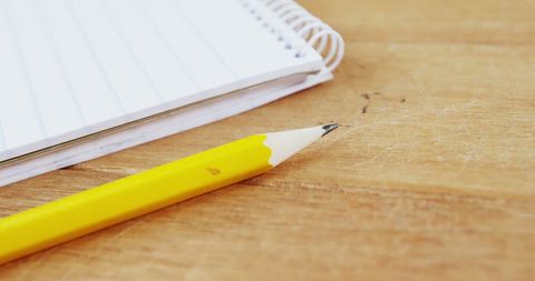 Yellow Pencil and Spiral Notebook on Wooden Desk - Download Free Stock Images Pikwizard.com