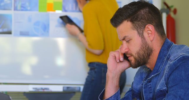 Mid-30s Professional Man Working Thoughtfully in Office Environment - Download Free Stock Images Pikwizard.com