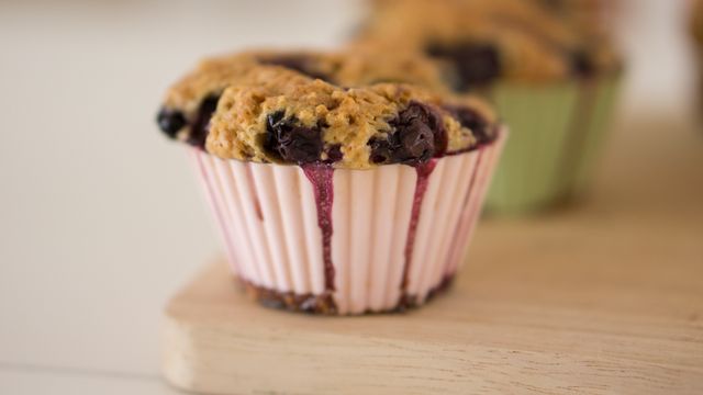 Close-Up of Freshly Baked Blueberry Muffin in Paper Liner - Download Free Stock Photos Pikwizard.com