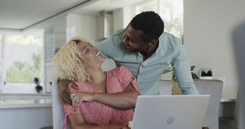 Happy Connection African American Friends Enjoying Device at Home