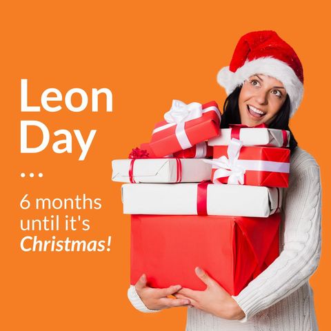 celebrating leon day with excited woman holding christmas gifts - Download Free Stock Templates Pikwizard.com