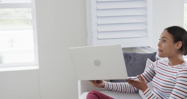 Woman Working on Laptop at Home in Bright Living Room - Download Free Stock Images Pikwizard.com