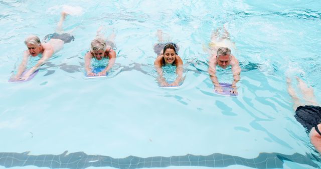 Group of Senior Citizens and Young Woman Taking Swimming Lesson - Download Free Stock Images Pikwizard.com