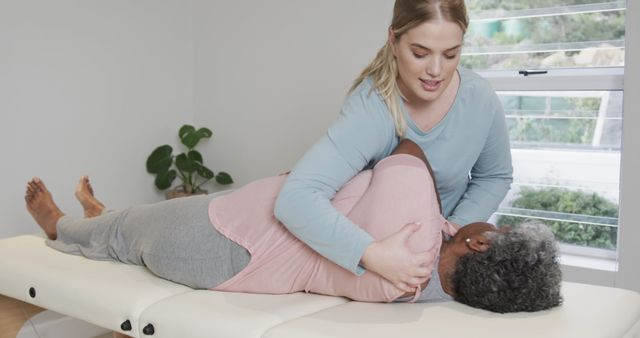 Physical Therapist Adjusting Senior Patient's Posture During Session - Download Free Stock Images Pikwizard.com