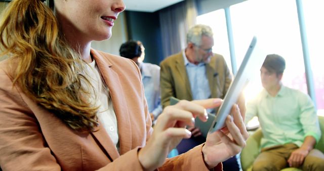 Businesswoman using digital tablet during office meeting - Download Free Stock Images Pikwizard.com