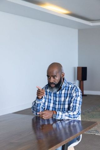 Confident Professional Leading Discussion in Modern Office