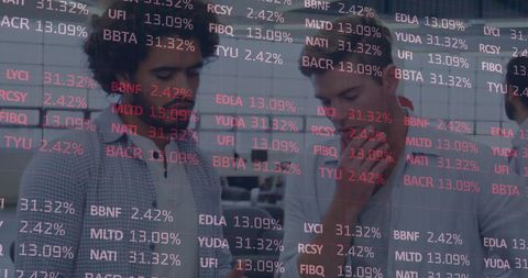 Financial Analysts Exploring Global Stock Market Data in Modern Office