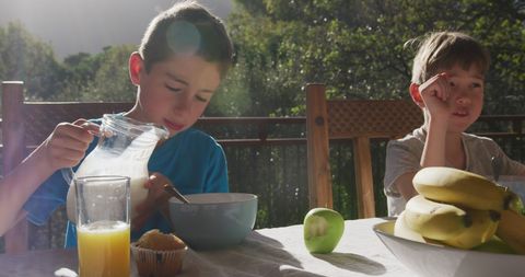 Happy Caucasian Boys Enjoying Sunny Breakfast Outdoors - Download Free Stock Images Pikwizard.com