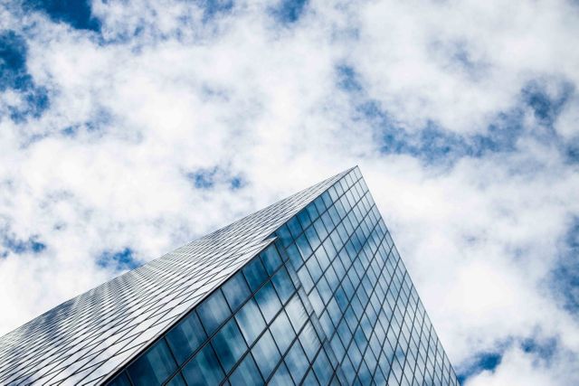 Low Angle Photography of Glass Building Under White Clouds and Blue Sky during Daytime - Download Free Stock Photos Pikwizard.com