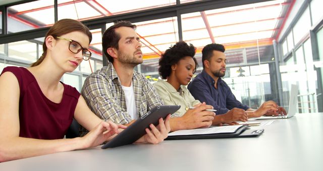 Diverse Team Focused During Collaborative Meeting in Modern Office - Download Free Stock Images Pikwizard.com