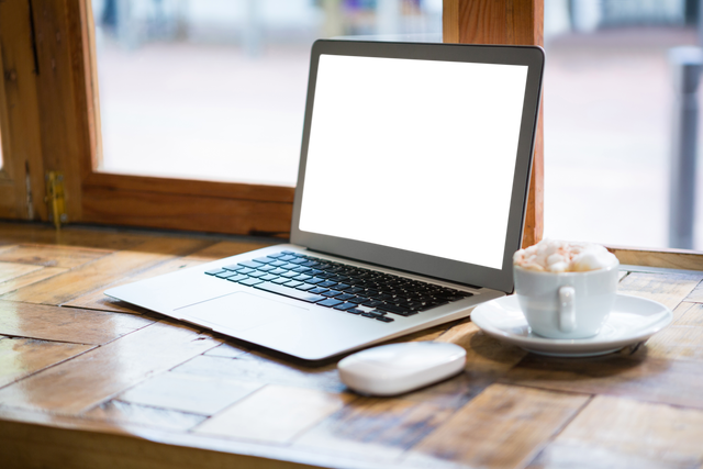 Transparent Laptop Next to Coffee Cup on Cafe Table - Download Free Stock Videos Pikwizard.com