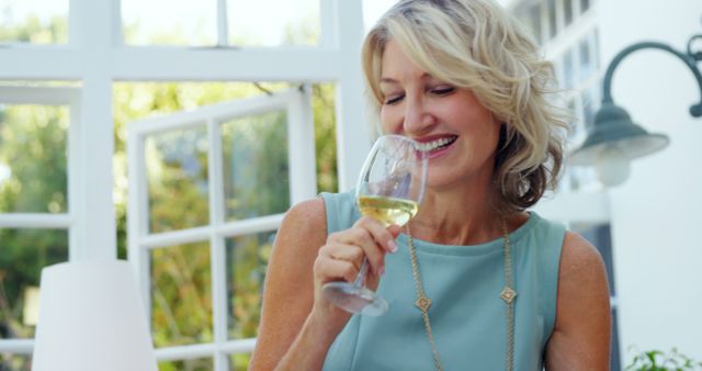 Smiling Mature Woman Enjoying White Wine Outdoors - Download Free Stock Images Pikwizard.com