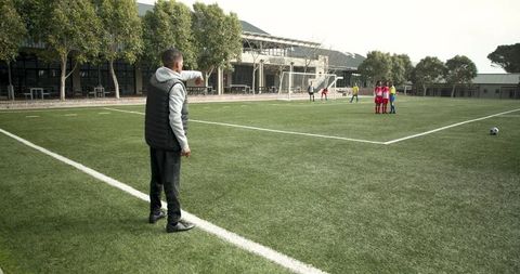 Coach Guiding Young Soccer Players During Practice - Download Free Stock Images Pikwizard.com