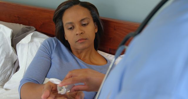 Female Patient Receiving Medical Assistance from Doctor at Home - Download Free Stock Images Pikwizard.com