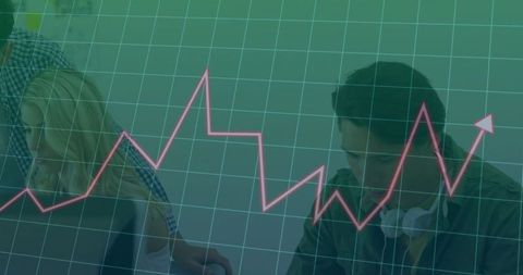 Dynamic Business Team Analyzing Data with Trend Graph Overlay