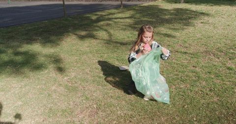 Young Eco Activist Participating in Outdoor Clean-Up Effort