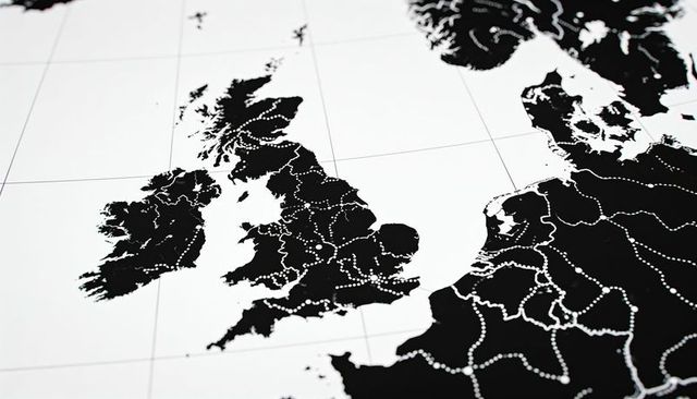 Monochrome british isles map showing dotted route network and latitude longitude gridlines