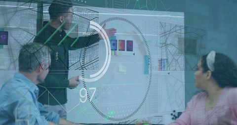 Team brainstorming with digital display in modern workplace