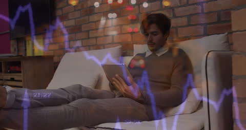 Young Professional Analyzing Digital Financial Data at Home