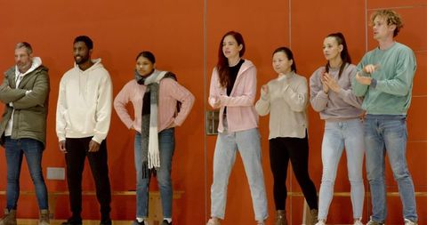 Diverse Group Participants Engaging in Energetic Workshop