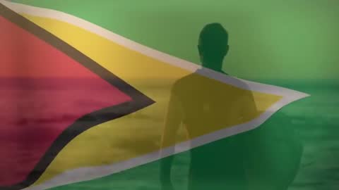 Silhouette of Surfer with Surfboard on Guyana Flag Backdrop