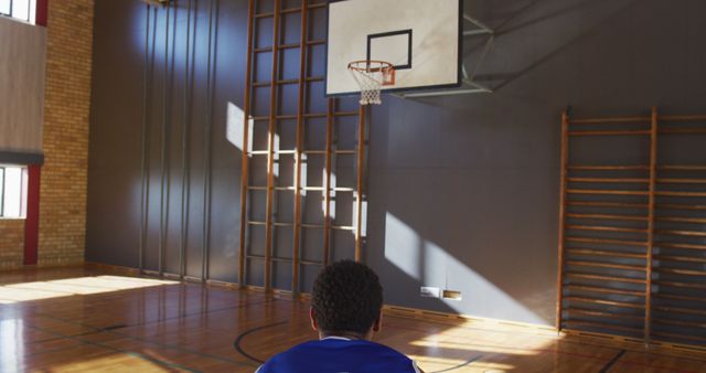 Young Player Practicing Alone in Empty Basketball Gym - Download Free Stock Images Pikwizard.com