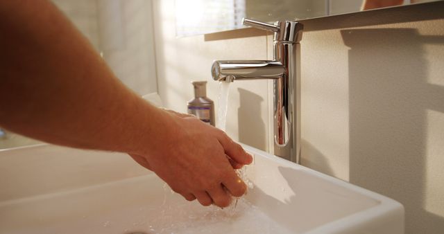 Person Washing Hands in Modern Bathroom Sink - Download Free Stock Images Pikwizard.com