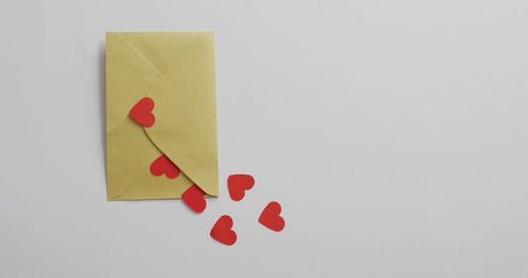 Envelope with red hearts for romantic message