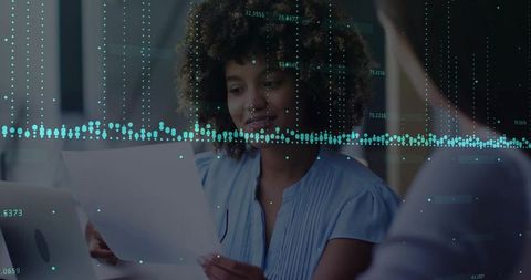 Woman analyzing data with digital overlay in office environment