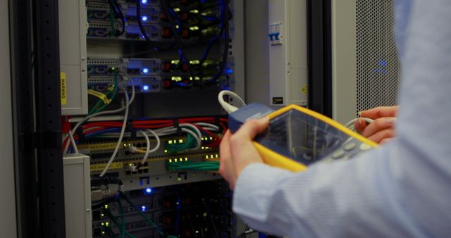 Technician using digital cable analyzer on server  in high quality  - Download Free Stock Photos Pikwizard.com