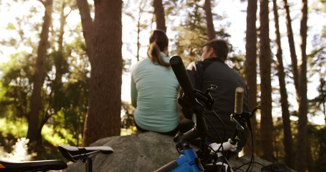Couple Enjoying Peaceful Forest During Sunset With Mountain Bikes - Download Free Stock Images Pikwizard.com