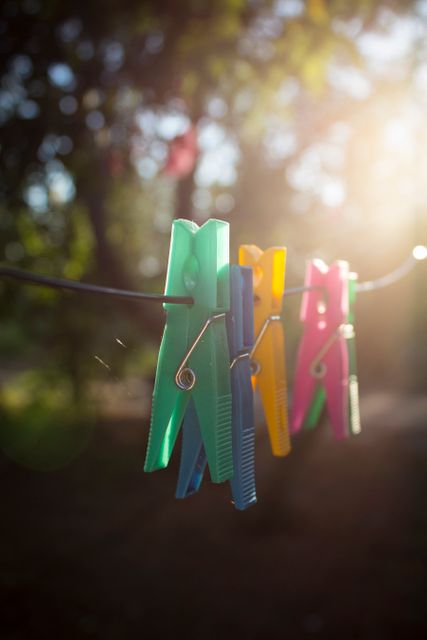Colorful Clothespins Hanging on Clothesline At Sunset - Download Free Stock Images Pikwizard.com