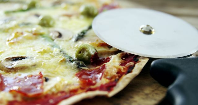 Freshly Baked Pizza with Olives and Vegetables Being Sliced - Download Free Stock Images Pikwizard.com