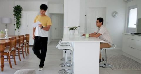 Couple dealing with paperwork at contemporary home