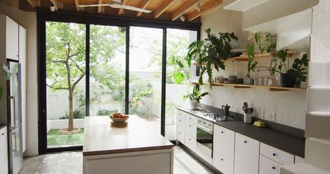 Modern Bright Kitchen with Natural Light and Outdoor Views - Download Free Stock Images Pikwizard.com