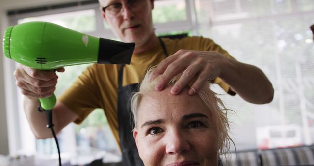 Male Hairdresser Blow Drying Woman's Wet Hair in Salon - Download Free Stock Images Pikwizard.com