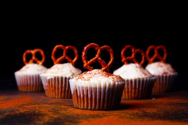 Gourmet Cupcakes with Pretzel Toppings on Dark Background - Download Free Stock Photos Pikwizard.com