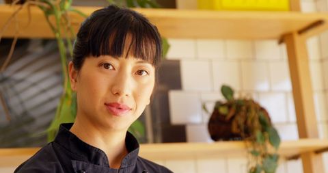 Confident chef in professional kitchen with copy space