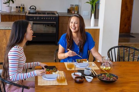 Family Bonding Over Healthy Meal in Rustic Kitchen