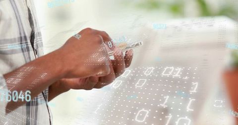 Holding smartphone with holographic binary overlay, hands scrolling, digital data concept