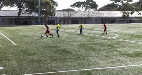 Young Soccer Players Practicing on Field under Clear Sky
