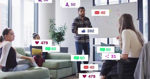 Leader presenting social media campaign during creative brainstorm in modern office lounge