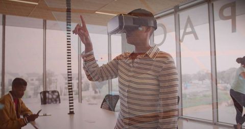 Woman in VR Headset Exploring and Interacting at Modern Office Table