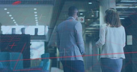 Business colleagues walking equipment tech overlay