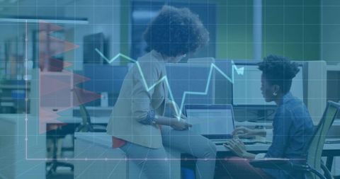 Two professionals collaborating at laptop and tablet with data analytics dashboard overlay