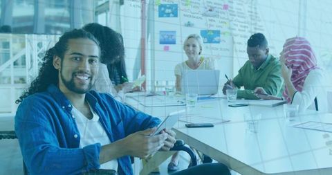 Inclusive Office Environment with Diverse Team Collaborating and Smiling