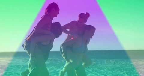 Friends Enjoying Piggyback Rides on Sunny Beach Day