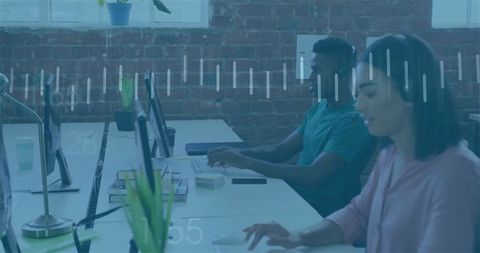 Focused professionals working in contemporary open-plan office