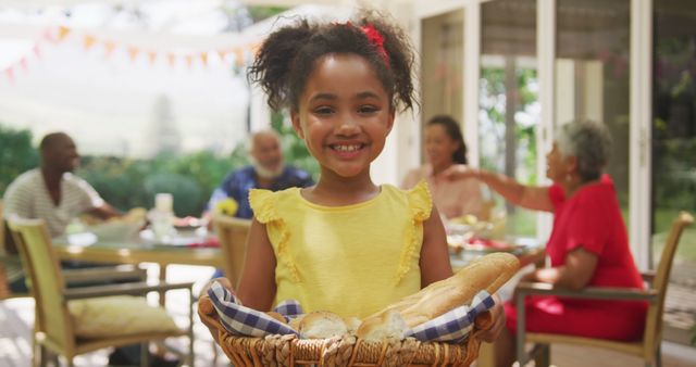 Smiling Girl Holding Bread Basket at Family Gathering - Download Free Stock Images Pikwizard.com