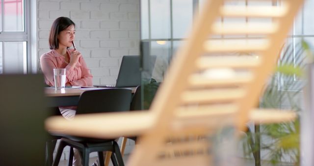 Focused Woman Working in Modern Office with Laptop - Download Free Stock Images Pikwizard.com